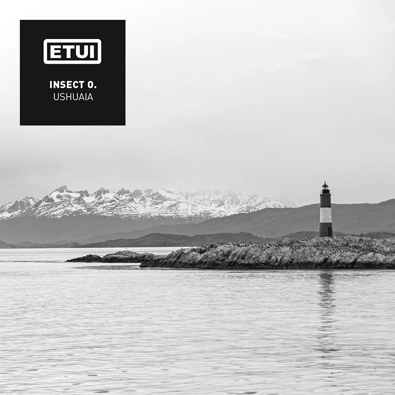 Artwork for Ushuaia with a lighthouse and snowy mountains in the background